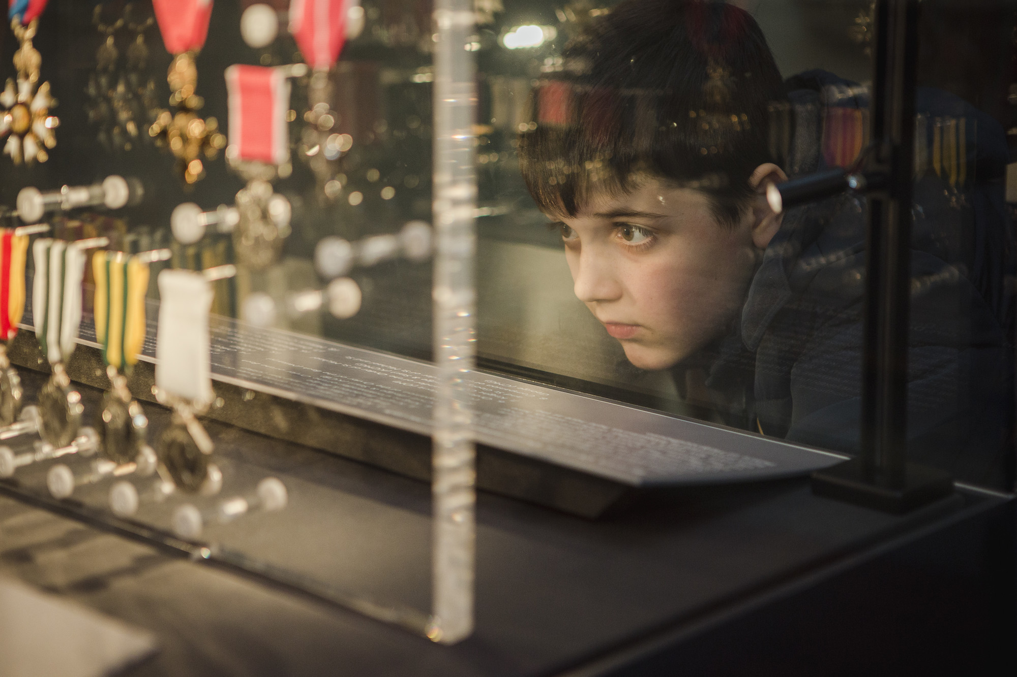 child looking at statue in Queen's Gallery