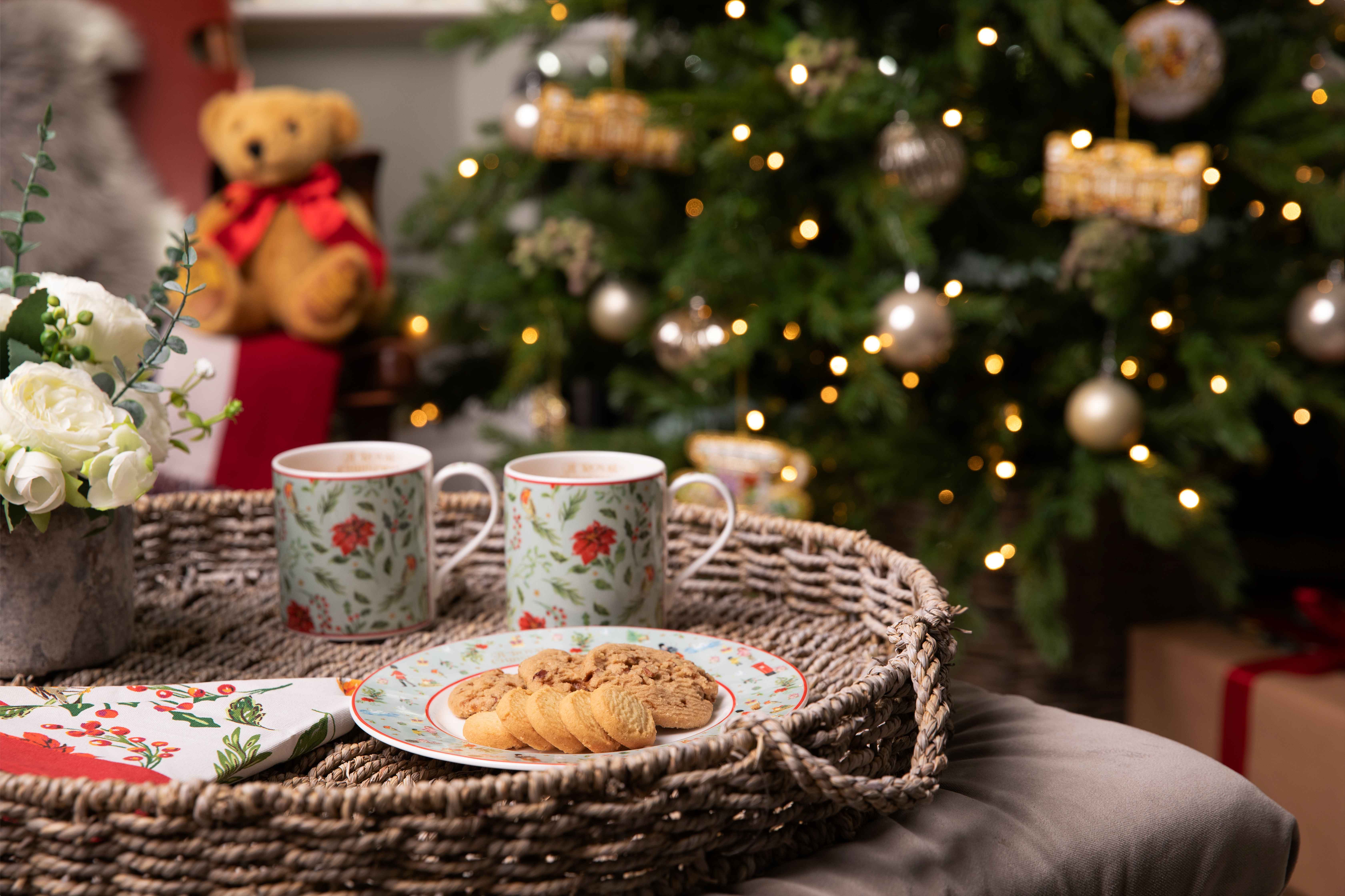 Gourmet biscuits on a plate by a Christmas tree