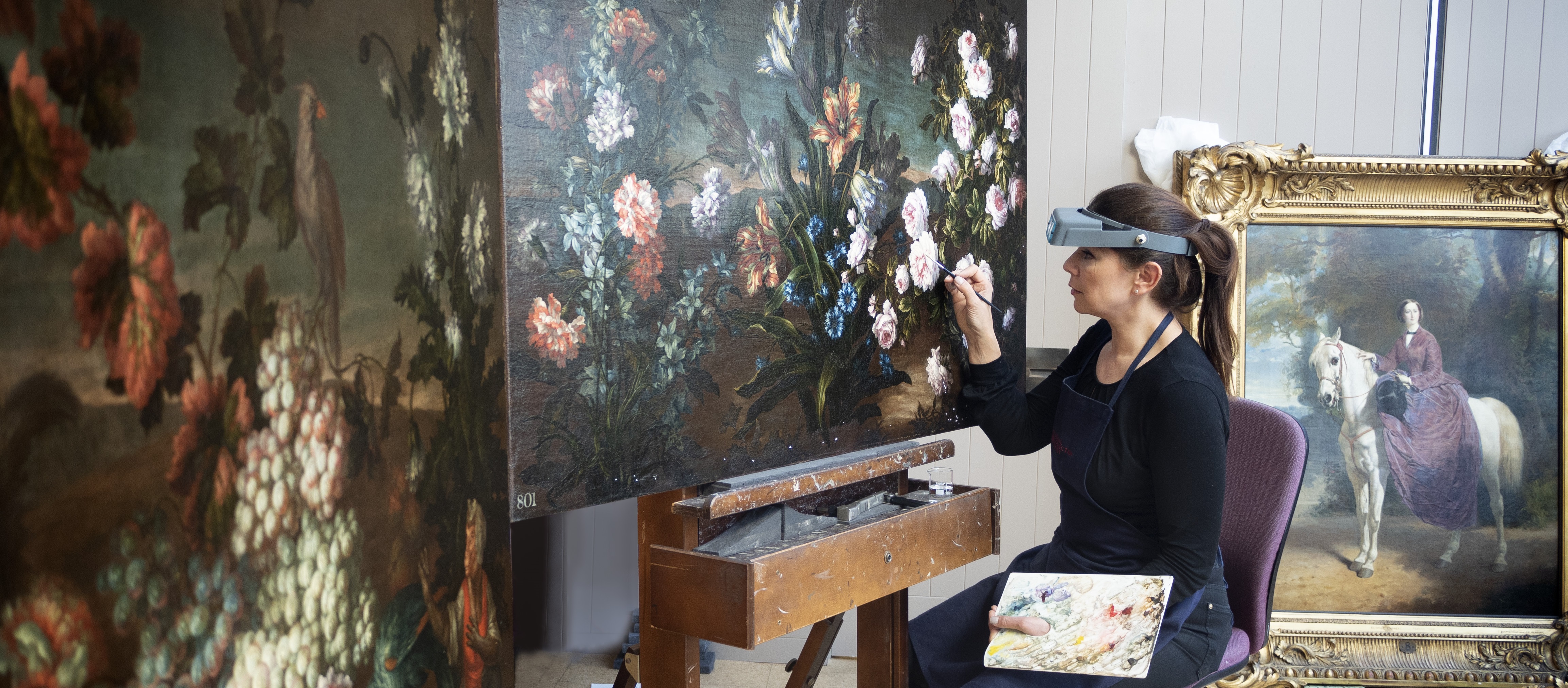 Staff work in picture conservation studio