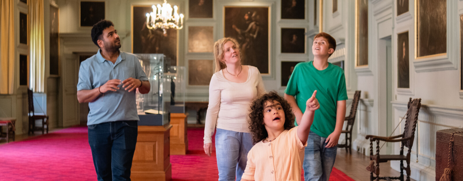 Family exploring the Great Gallery, Palace of Holyroodhouse 