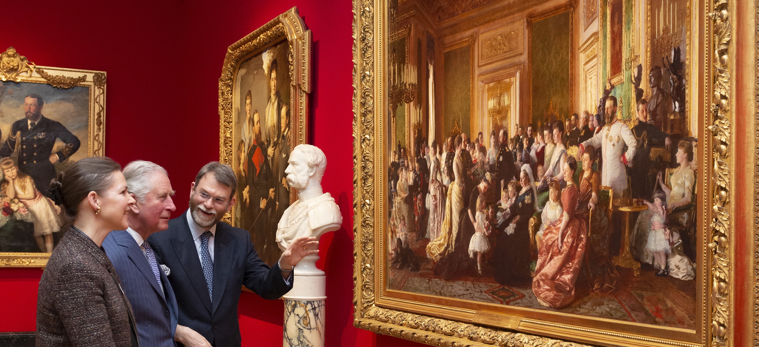 HM King Charles III visiting the exhibition 'Russia, Royalty & the Romanovs' with exhibition curators Caroline de Guitaut and Stephen Patterson