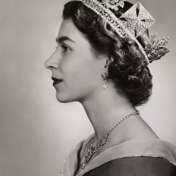 Head and shoulders portrait of HM The Queen in left profile. The Queen is wearing a light colour dress with sash, the Diamond Diadem, pearl and diamond drop earrings and the Nizam of Hyderabad Necklace. Unmounted.
The first official photographic sitting w