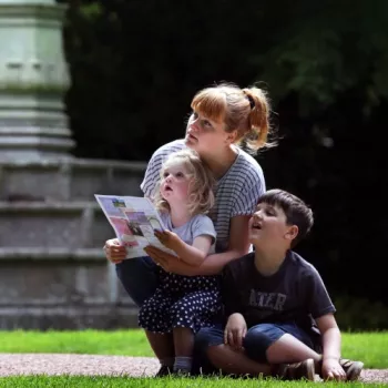 Family in the gardens of the Palace of holyroodhouse